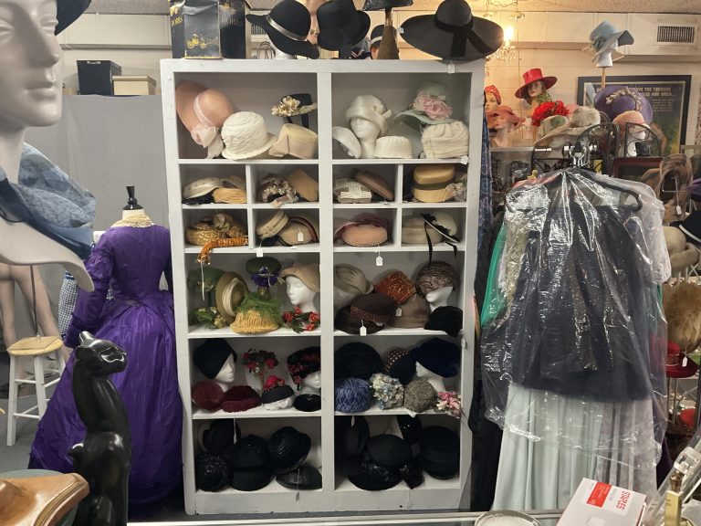 Cats Meow hats on shelf with dresses on side 768x576