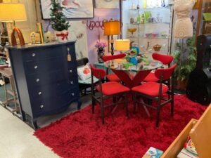 Benbrook antique mall, mid-century modern dining set round glass table with V shaped red base and 4 red upholstered chairs with dark wood frame